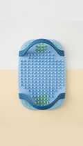 Ergonomic silicone foot scrubber mat with secure stirrups